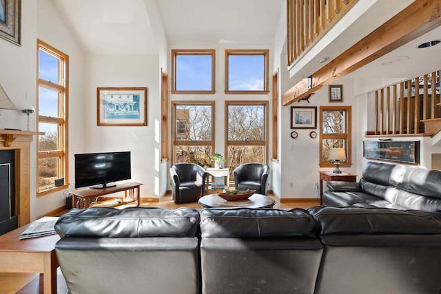 63 Swift Ln, Brewster, MA 02631 - living area with a fireplace and wood finished floors