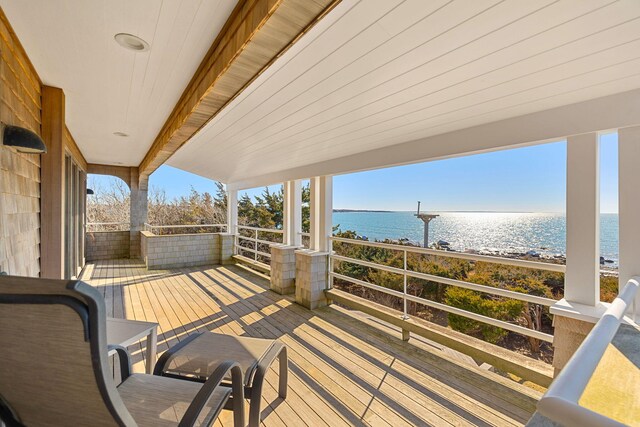 wooden deck with a water view