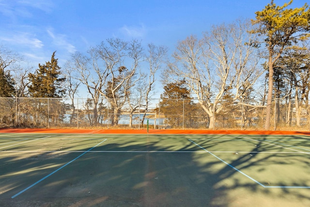 view of sport court featuring fence