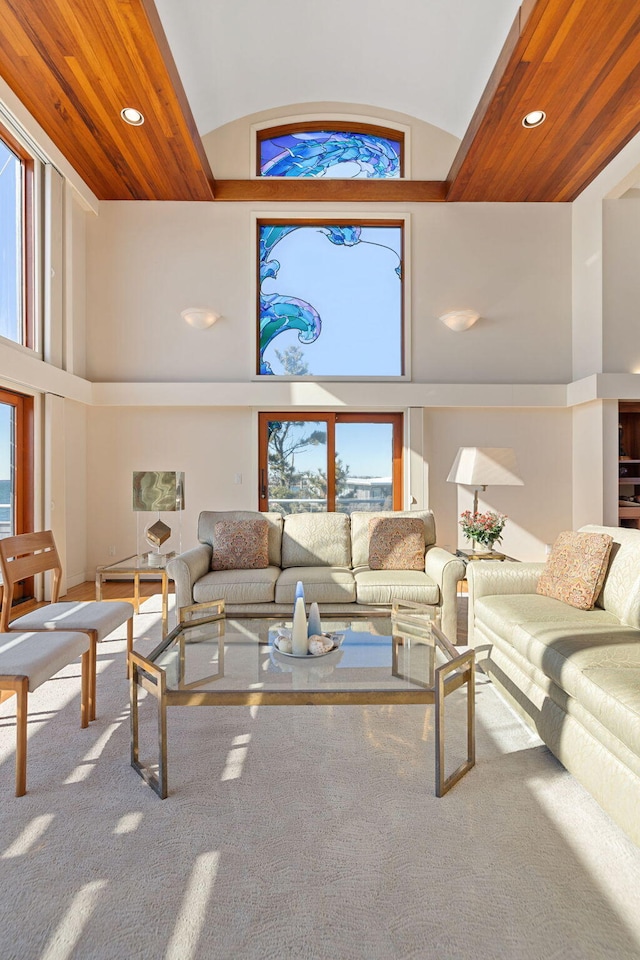 living area featuring wood ceiling, high vaulted ceiling, and recessed lighting