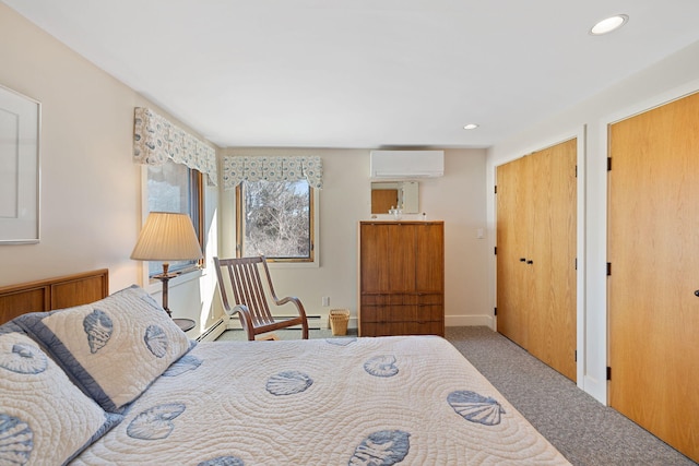 carpeted bedroom with a wall unit AC, a baseboard radiator, multiple closets, and recessed lighting