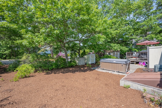 64 Manitoba Rd, Mashpee, MA 02649 - view of yard featuring a hot tub and a wooden deck