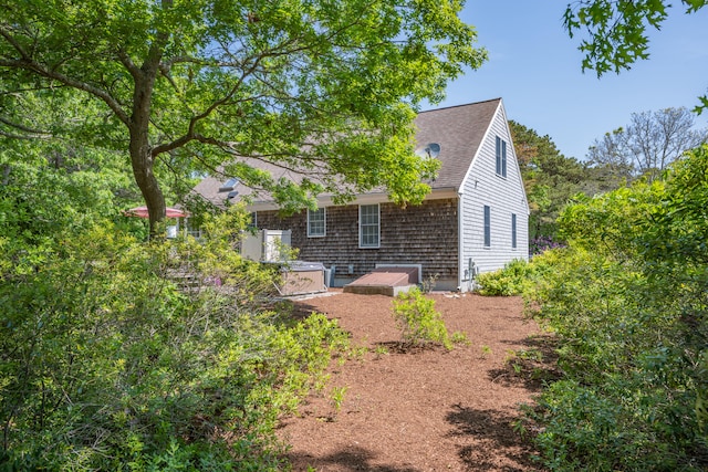 64 Manitoba Rd, Mashpee, MA 02649 - view of property exterior with a shingled roof