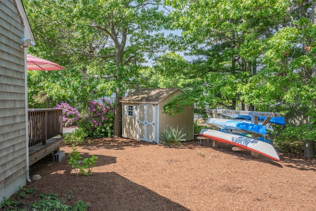 64 Manitoba Rd, Mashpee, MA 02649 - view of yard featuring a storage shed and view of scattered trees