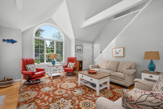 64 Manitoba Rd, Mashpee, MA 02649 - living area with lofted ceiling, wood finished floors, and stairs