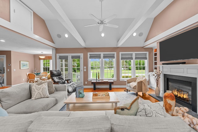 350 Plum St, West Barnstable, MA 02668 - living room featuring recessed lighting, a glass covered fireplace, plenty of natural light, ceiling fan, and high vaulted ceiling