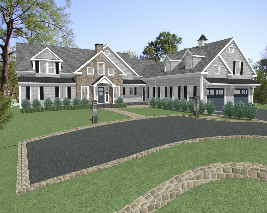 shingle-style home featuring a standing seam roof, an attached garage, a chimney, and a front lawn