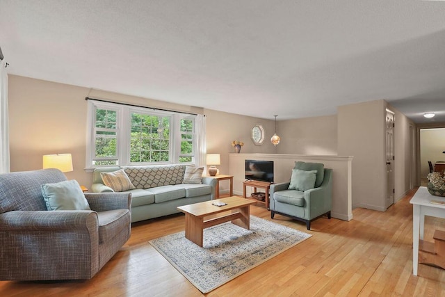 566 County Rd, Pocasset, MA 02559 - living room featuring light wood-type flooring and baseboards