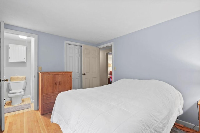 566 County Rd, Pocasset, MA 02559 - bedroom with light wood-type flooring and a closet