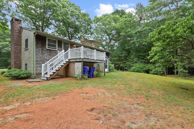 566 County Rd, Pocasset, MA 02559 - view of grassy yard with stairs and a wooden deck