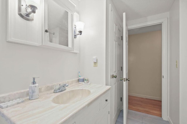566 County Rd, Pocasset, MA 02559 - bathroom with vanity and wood finished floors