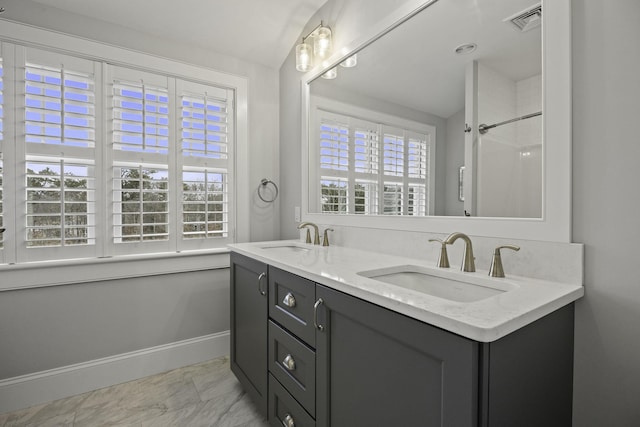 5 Jakes Ln, Brewster, MA 02631 - bathroom with double vanity, visible vents, a sink, and marble finish floor