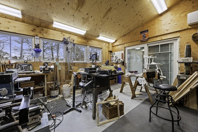 5 Jakes Ln, Brewster, MA 02631 - misc room featuring wood walls, vaulted ceiling, concrete floors, and a workshop area