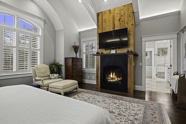 5 Jakes Ln, Brewster, MA 02631 - bedroom with baseboards, wood finished floors, vaulted ceiling, and a lit fireplace