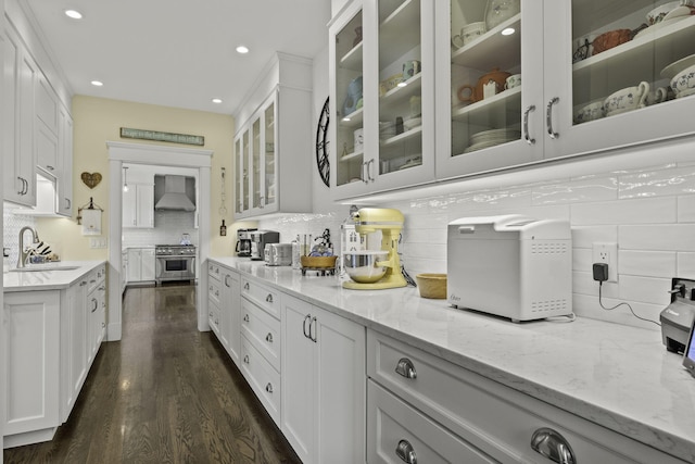 5 Jakes Ln, Brewster, MA 02631 - kitchen with white cabinets, a sink, wall chimney exhaust hood, high end range, and tasteful backsplash