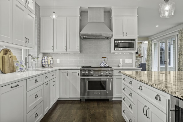 5 Jakes Ln, Brewster, MA 02631 - kitchen featuring appliances with stainless steel finishes, a sink, white cabinets, wine cooler, and wall chimney exhaust hood