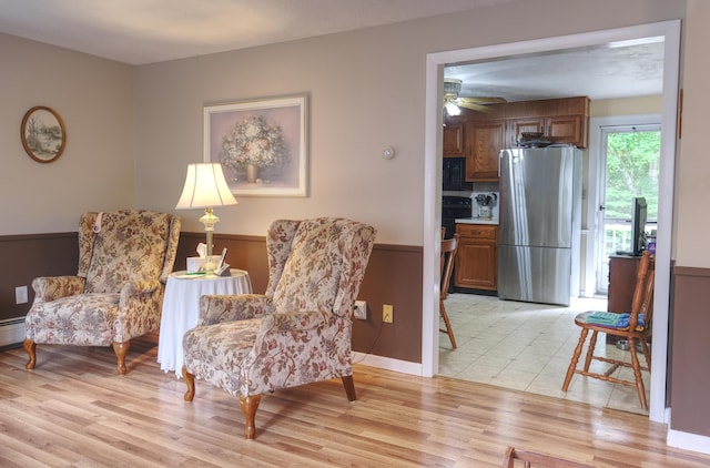 103 Moco Rd, West Barnstable, MA 02668 - living area with light wood-type flooring and a ceiling fan