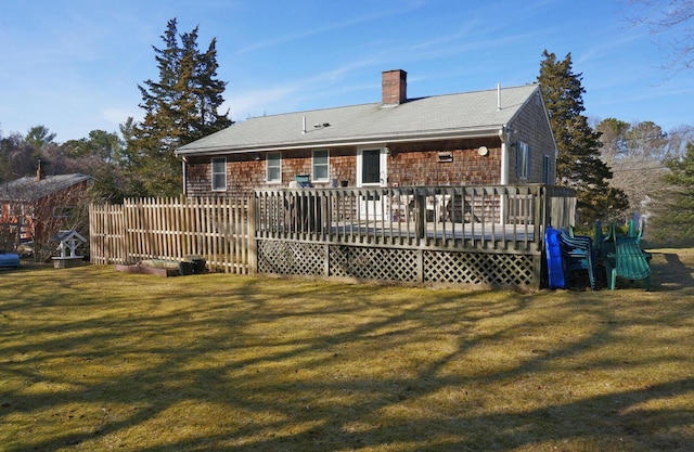 103 Moco Rd, West Barnstable, MA 02668 - back of property featuring a chimney, a lawn, and a deck