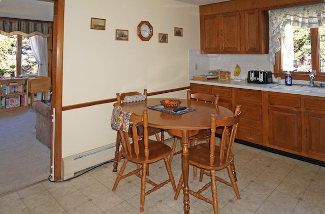 103 Moco Rd, West Barnstable, MA 02668 - dining area with baseboard heating and healthy amount of natural light