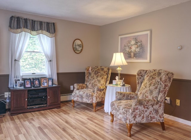 103 Moco Rd, West Barnstable, MA 02668 - living area with baseboard heating and light wood-style floors