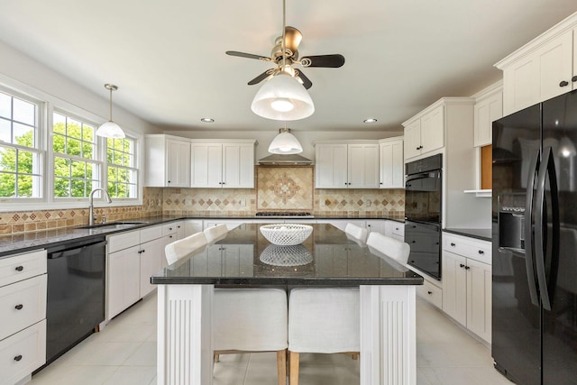 14 Kendrick Ave, Wellfleet, MA 02667 - kitchen with black appliances, a sink, a center island, white cabinetry, and recessed lighting