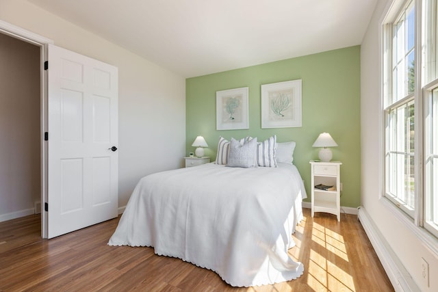 14 Kendrick Ave, Wellfleet, MA 02667 - bedroom featuring multiple windows, wood finished floors, and baseboards