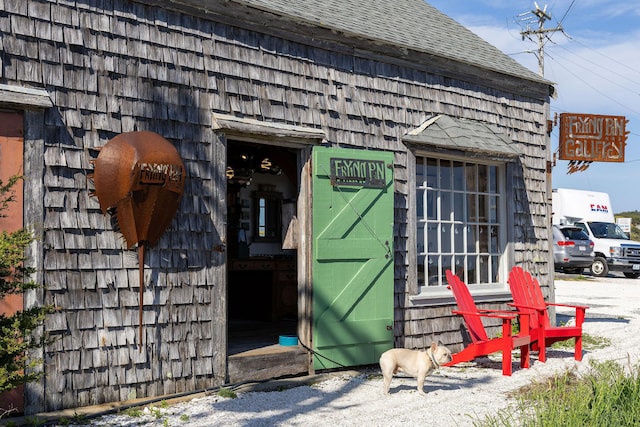 14 Kendrick Ave, Wellfleet, MA 02667 - view of exterior entry with a shingled roof