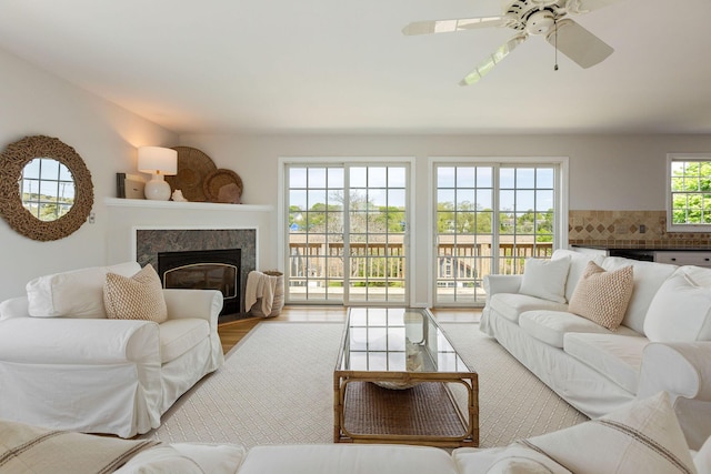 14 Kendrick Ave, Wellfleet, MA 02667 - living room with a tile fireplace, a ceiling fan, and wood finished floors