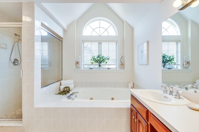 bathroom with lofted ceiling, plus walk in shower, and vanity