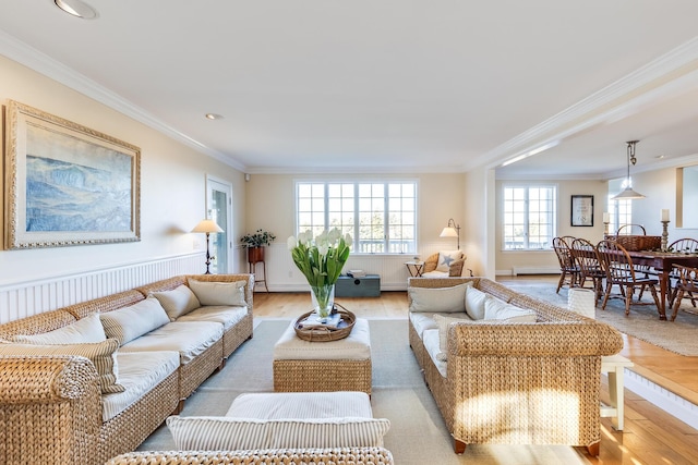 living room featuring crown molding and light wood-type flooring