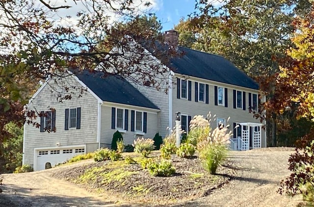 341 Service Rd, Sandwich, MA 02563 - colonial-style house featuring driveway, a chimney, and a garage