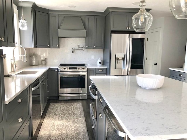 341 Service Rd, Sandwich, MA 02563 - kitchen featuring appliances with stainless steel finishes, a center island, light stone countertops, a sink, and custom exhaust hood
