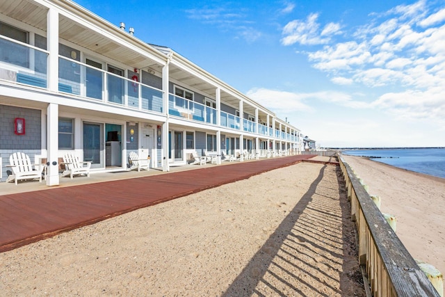 view of property's community featuring a view of the beach and a water view