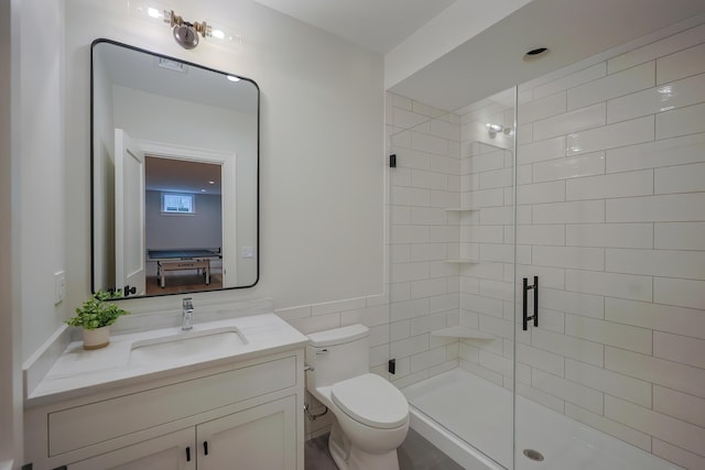 72 Woodside Dr, East Falmouth, MA 02536 - bathroom featuring a shower stall, vanity, tile walls, and toilet