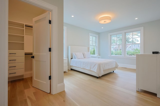 72 Woodside Dr, East Falmouth, MA 02536 - bedroom featuring recessed lighting, light wood finished floors, baseboards, and a walk in closet