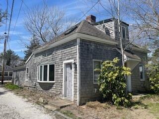 view of side of property with a chimney