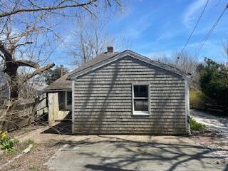 view of side of home with a chimney