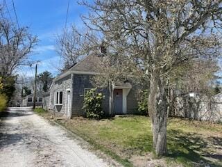 view of property exterior with driveway
