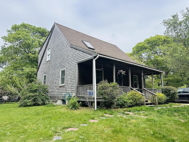96 Machester Ave, Oak Bluffs, MA 02557 - view of property exterior featuring covered porch, a yard, and a shingled roof