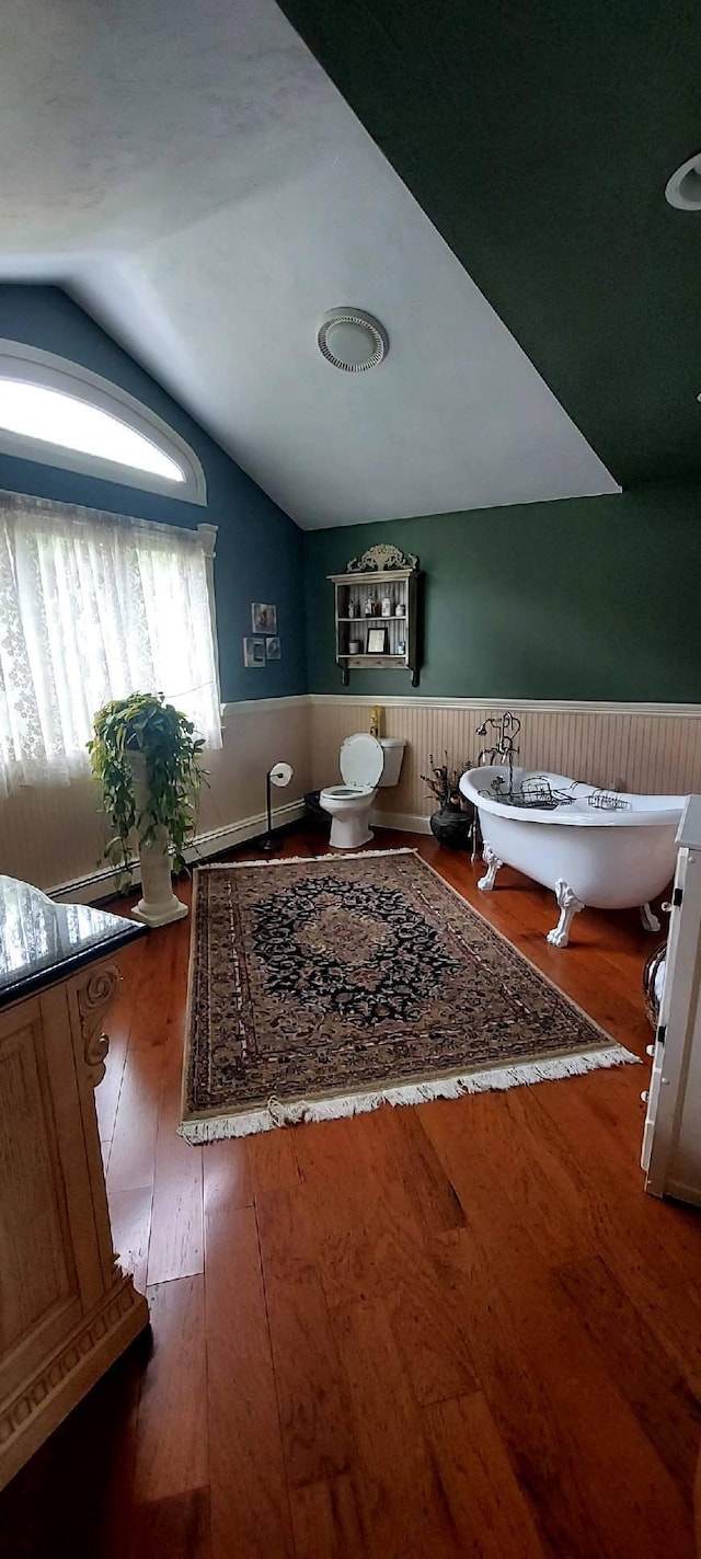 3 Wolf Rd, Buzzards Bay, MA 02532 - living area featuring vaulted ceiling, a wainscoted wall, and hardwood / wood-style flooring