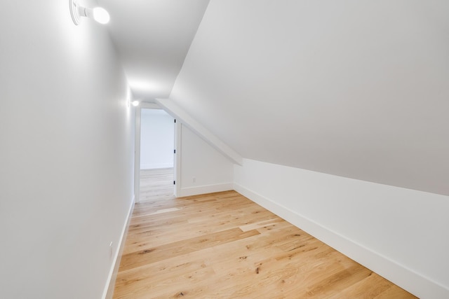 213 N Falmouth Hwy Unit 5B, North Falmouth, MA 02556 - additional living space with baseboards, light wood finished floors, and vaulted ceiling