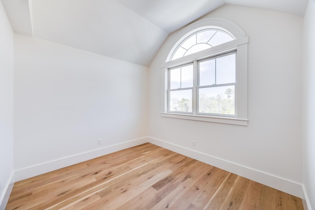 213 N Falmouth Hwy Unit 5B, North Falmouth, MA 02556 - spare room with vaulted ceiling, wood finished floors, and baseboards