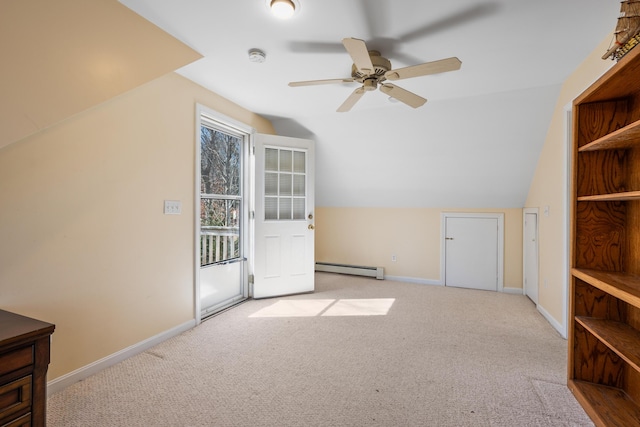 bonus room featuring baseboard heating, baseboards, lofted ceiling, and carpet