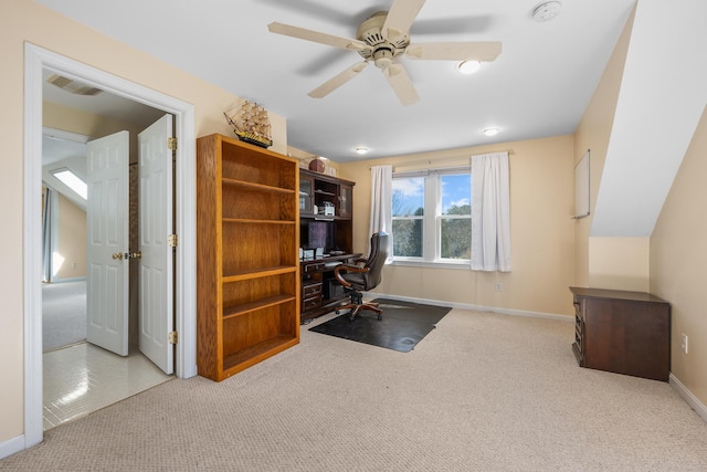 carpeted office space featuring visible vents, baseboards, and a ceiling fan