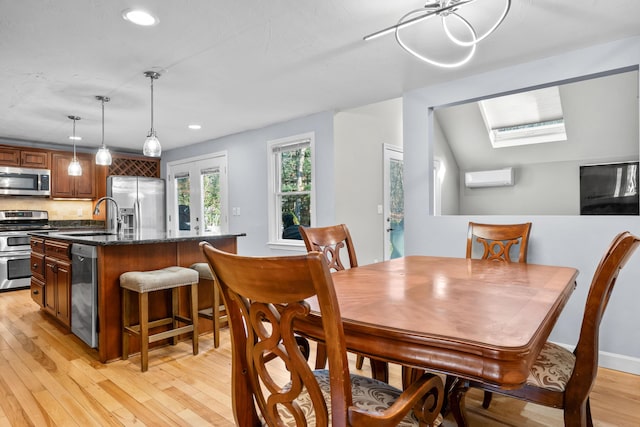 56 Allan Rd, West Barnstable, MA 02668 - dining space with light wood-style flooring, recessed lighting, an AC wall unit, and a skylight