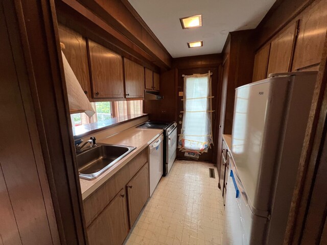 kitchen with sink and white appliances