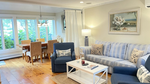 40 Brant Rock Rd, Mashpee, MA 02649 - living room with light wood finished floors, a chandelier, and baseboard heating
