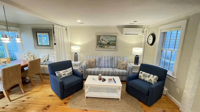 40 Brant Rock Rd, Mashpee, MA 02649 - living room featuring an AC wall unit and wood-type flooring