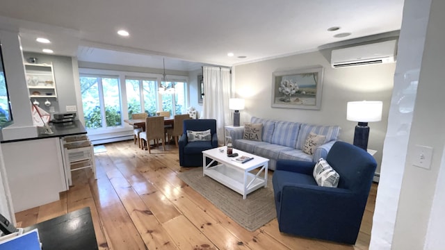 40 Brant Rock Rd, Mashpee, MA 02649 - living room featuring a wall unit AC, a baseboard radiator, light wood-type flooring, recessed lighting, and a chandelier