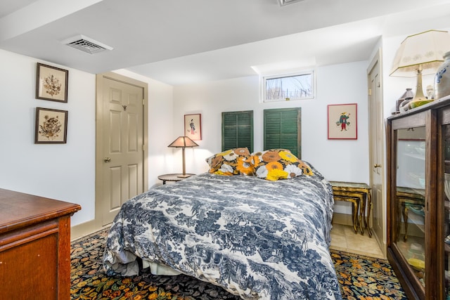 tiled bedroom with visible vents